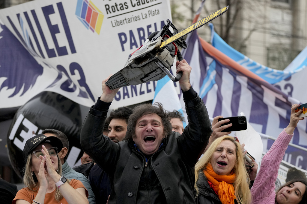 File Photo: Presidential hopeful Javier Milei brandishes a chainsaw during a campaign rally in La Plata, Argentina, Sept. 12, 2023. (Photo by Natacha Pisarenko / AP)