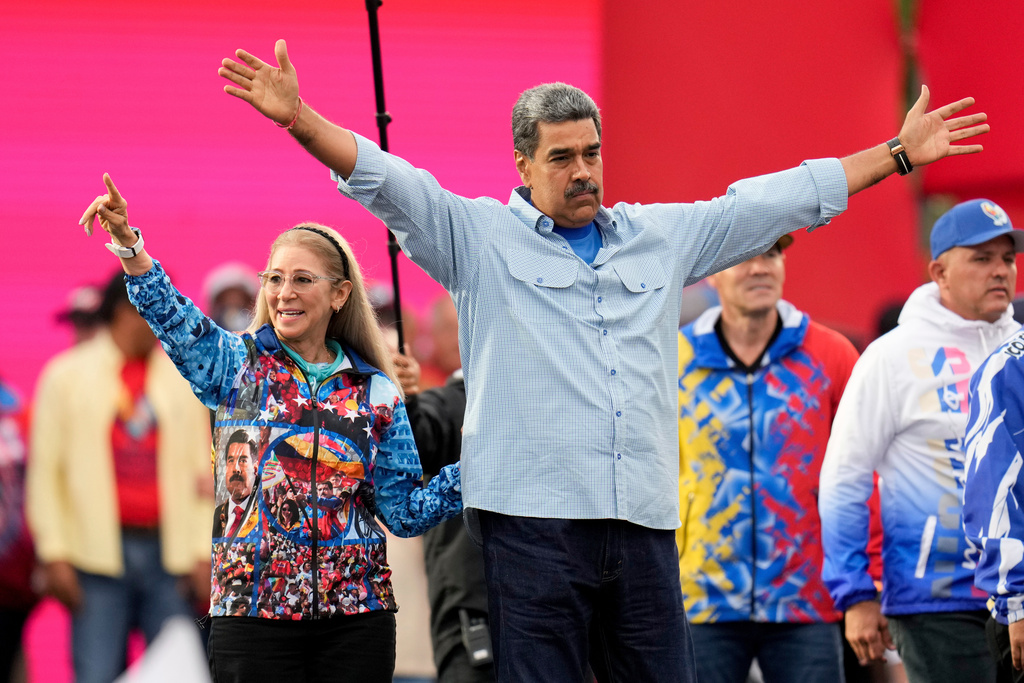 File Photo: President Nicolas Maduro acknowledges supporters alongside first lady Cilia Flores during his closing election campaign rally in Caracas, Venezuela on July 25, 2024. (Photo by Fernando Vergara / AP)
